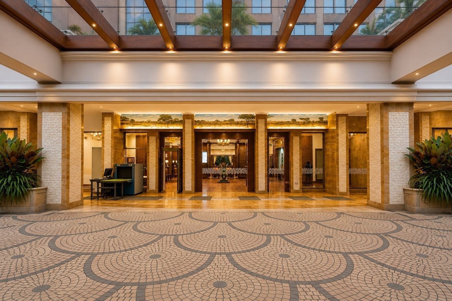 The entrance hall of Nairobi Serena Hotel, with a mosaic floor and a skylit ceiling