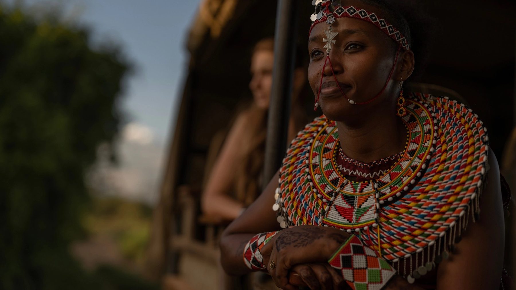Samburu woman wearing layered beaded necklaces and a beaded headband, photographed on a visit from Soroi Larsens Camp
